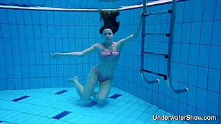 Sexy girl displays her body underwater.