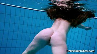 Sexy girl displays her body underwater.