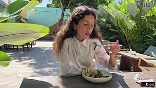 Girl eats lunch in public cafe