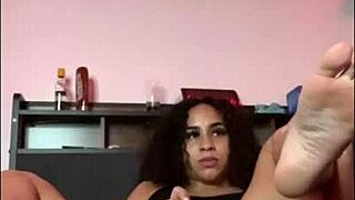 She got horny while stretching on her bed, grabbing a dildo to fuck her pussy deeply with curly hair shaking