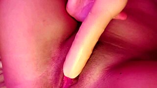young latina in bedroom masturbates with big dildo and socks, leading to creamy cumshot