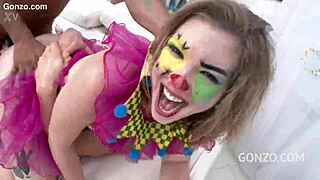 Ella Nova takes on 10 guys in a wild clown gangbang 😈