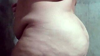 Curvy latina bathing solo in the shower