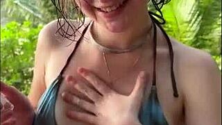 horny teen 18+ in bikini gives oily titjob and sucks my dick on public beach