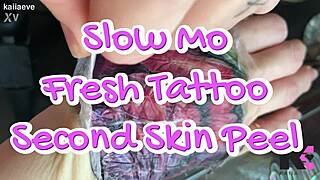 Slow motion fresh tattoo second skin peel