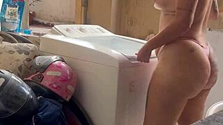 woman washes clothes freely with pussy and tits out