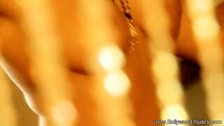 brunette indian woman performs erotic dance to arouse with teasing striptease