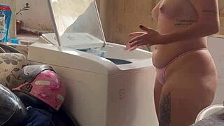 woman washes clothes freely with pussy and tits out