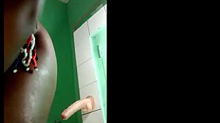 black girl fixes dildo on wall to get fucked