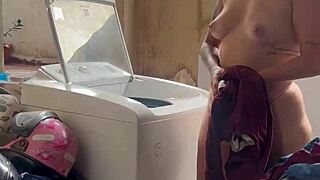 woman washes clothes freely with pussy and tits out