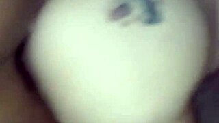 Couple engages in interracial doggystyle position during their encounter.