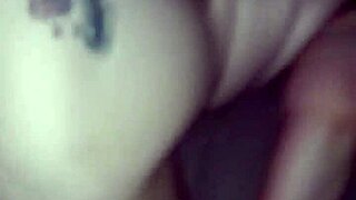 Couple engages in interracial doggystyle position during their encounter.