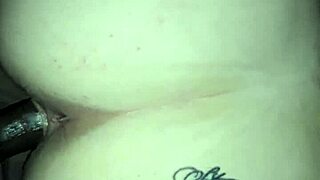 Couple engages in interracial doggystyle position during their encounter.