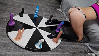 Wheel of dildos she wants to win her orgasm here