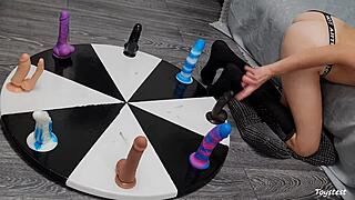 Wheel of dildos she wants to win her orgasm here