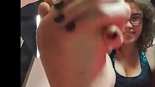 Brunette in glasses compiles foot interest messages