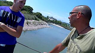Woman fucks fishing guys outdoors.