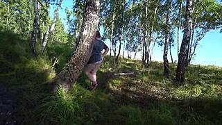 In the forest, lesbian girlfriends use a dildo. Girlfriend fucks milf doggystyle, shaking big ass in panties, big boobs pov.