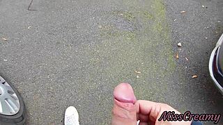 pulling out my cock between cars on the street, she helps me cum