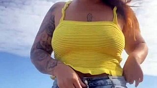 Young Woman Flashes Swollen Pussy in Tight Bikini on Beach
