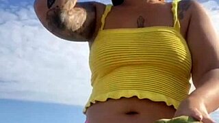 Young Woman Flashes Swollen Pussy in Tight Bikini on Beach
