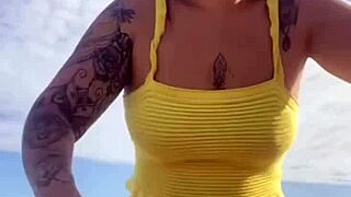 Young Woman Flashes Swollen Pussy in Tight Bikini on Beach