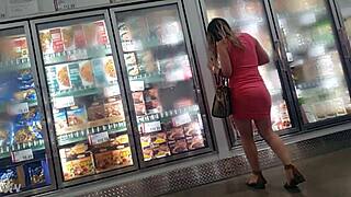 candid glimpse of ass under sundress hints at hidden curves and big tits