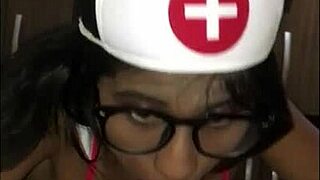 Young Latina Nurse Cares For Patient In Hospital