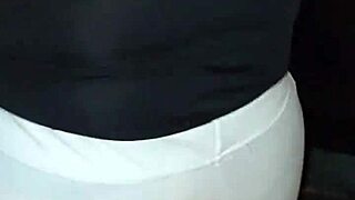 the venezuelan mature woman is on the street, perhaps shopping or walking, in a neutral story