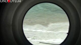 Busty cougar rides hard on beach while voyeur watches, ending with facial cum load