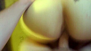 girlfriend kneels in front of the desk