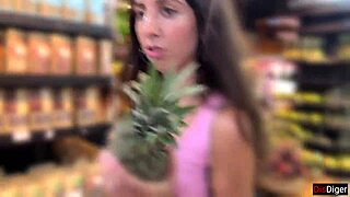 a brunette amateur walks in a public supermarket after an outdoor encounter