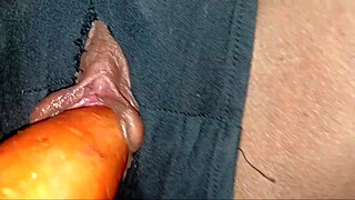 She achieves orgasm with fruit inserted in her pussy.