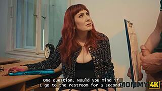 TEACHER DISCUSSES JOB WITH STUDENT IN CLASSROOM