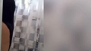 Cute latina teen enjoys a relaxing shower on webcam with tattoos