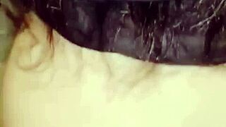 Amosinas chats with a friend in the airport bathroom