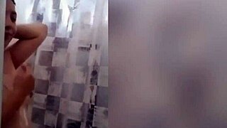 Cute latina teen enjoys a relaxing shower on webcam with tattoos