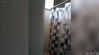 Cute latina teen enjoys a relaxing shower on webcam with tattoos