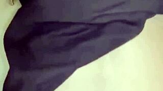 Amosinas chats with a friend in the airport bathroom