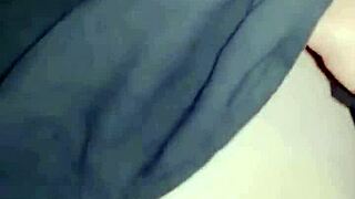 Amosinas chats with a friend in the airport bathroom