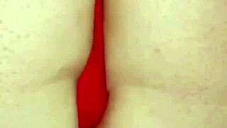 Amosinas chats with a friend in the airport bathroom