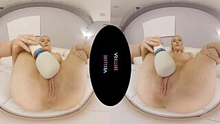 Vrallure looks pretty in pink while using her dildo and vibrator for masturbation