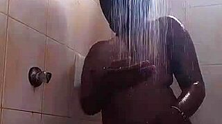 sexy ebony teen oils up in steamy shower showing off her curves