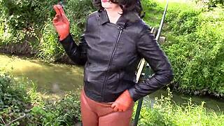 Milf Wife Smokes Seductively in Tight Leather Trousers Outdoors