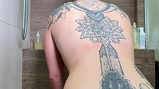 a woman relaxes in the shower playfully using her dildo for solo fun