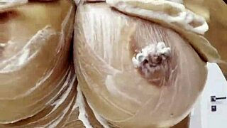 monika fox strips naked at home smears cream over pierced big tits and juicy ass