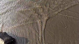 Priscila and Nicoly get bent over fucked hard by strangers on the beach in public orgy