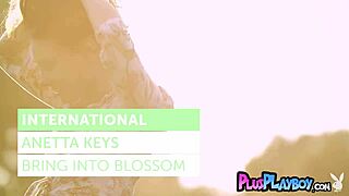 anetta keys boldly strips tits outdoors in intense grass pose