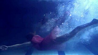 Lilia Mihalkova and Natalia Kupalka dive underwater for steamy teen lesbian pool play