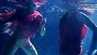Lilia Mihalkova and Natalia Kupalka dive underwater for steamy teen lesbian pool play